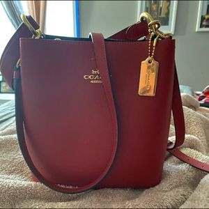 Red authentic coach purse.